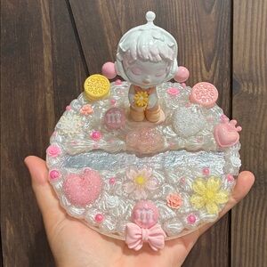 Charming Figurine with Candy and Floral Details